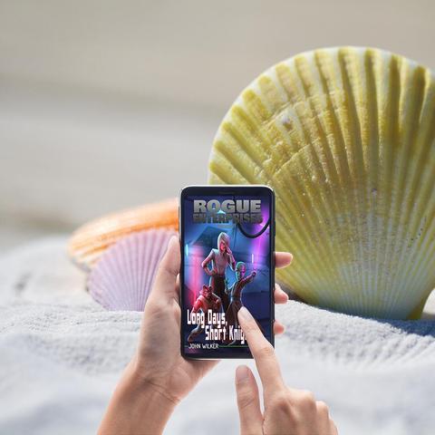 The image shows a person holding a smartphone with both hands, displaying the book "Rogue Enterprises" on the screen. The book’s title is prominently displayed at the top, with the subtitle "Long Days, Short Knights” and the author's name, "John Wilker," below it. The books’s cover art features a character wielding a weapon, set against a vibrant, neon-lit background. The phone is positioned in the foreground, with the person's fingers interacting with the screen.

In the background, there is a sandy beach setting, with a enormous yellow seashell and a smaller pink seashell visible. The sand appears soft and light-colored, contributing to a serene beach atmosphere. The overall composition juxtaposes the digital world of the game with the natural beauty of the beach, creating a visually appealing contrast.

Provided by @altbot, generated privately and locally using Ovis2-8B

🌱 Energy used: 0.179 Wh
